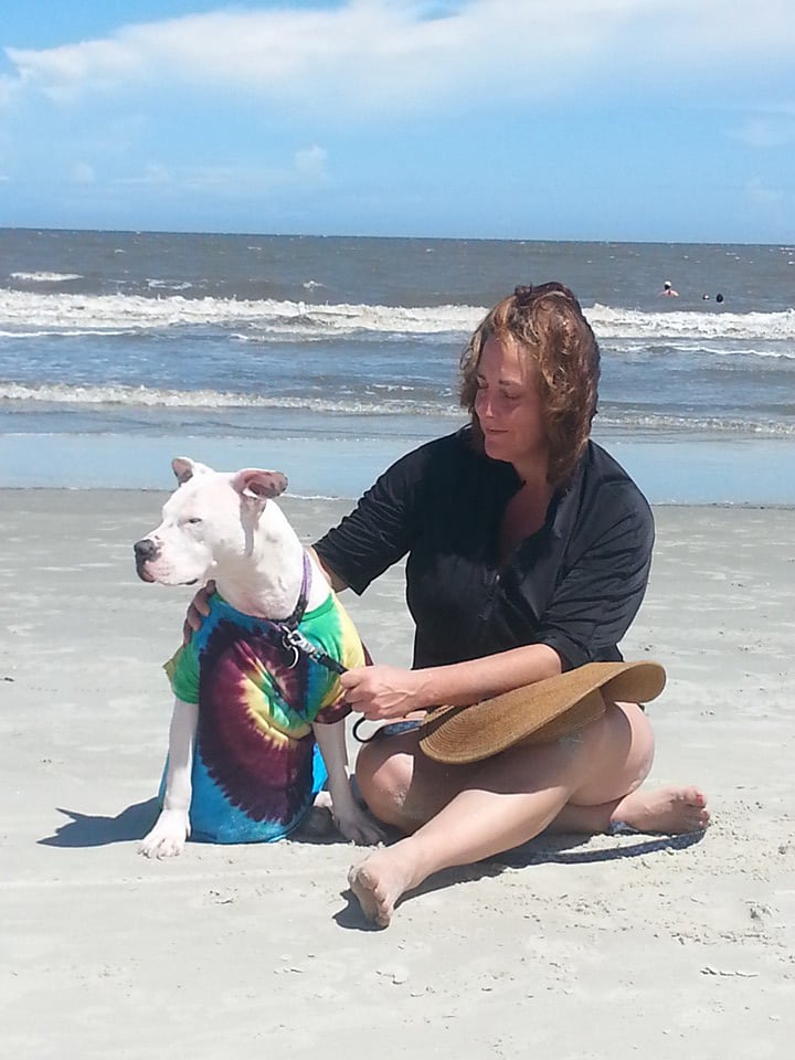 April on beach with her favorite pup